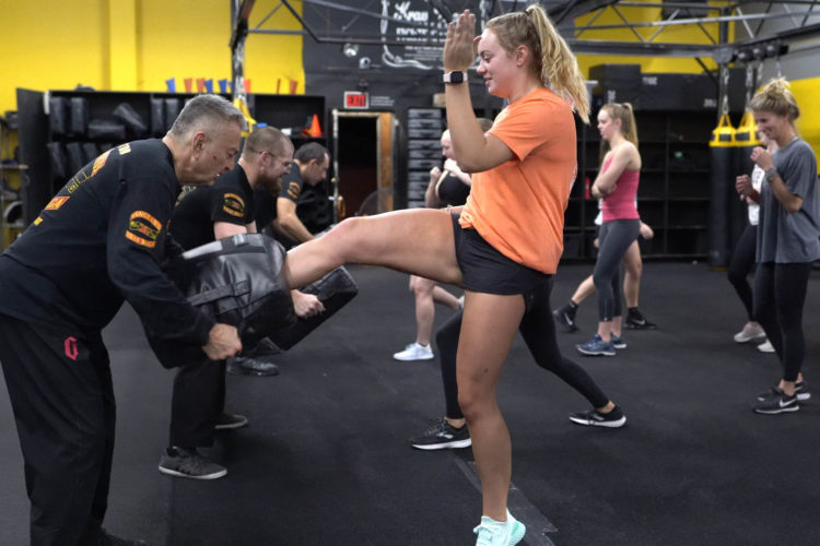 woman practicing kicks